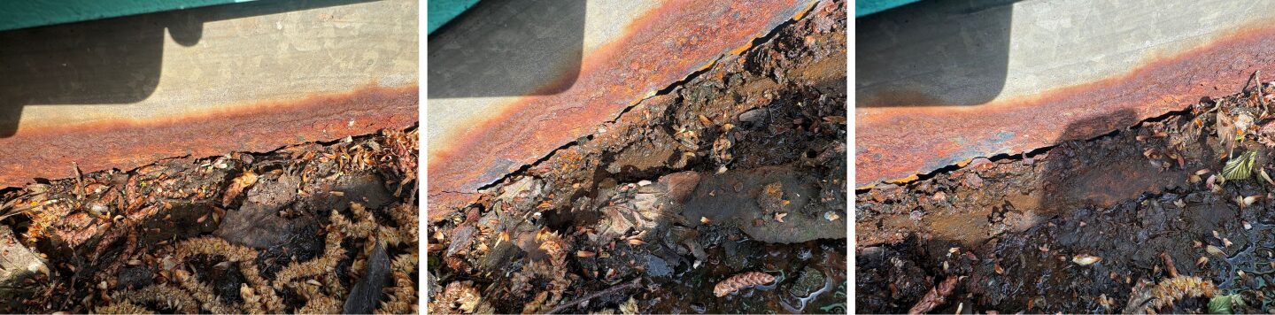 Industrial Gutter Failure. Corroded industrial gutter with holes caused by long-term corrosion