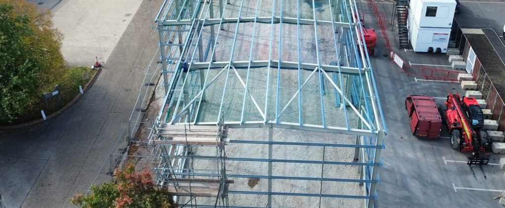 Building shell undergoing new roof and cladding